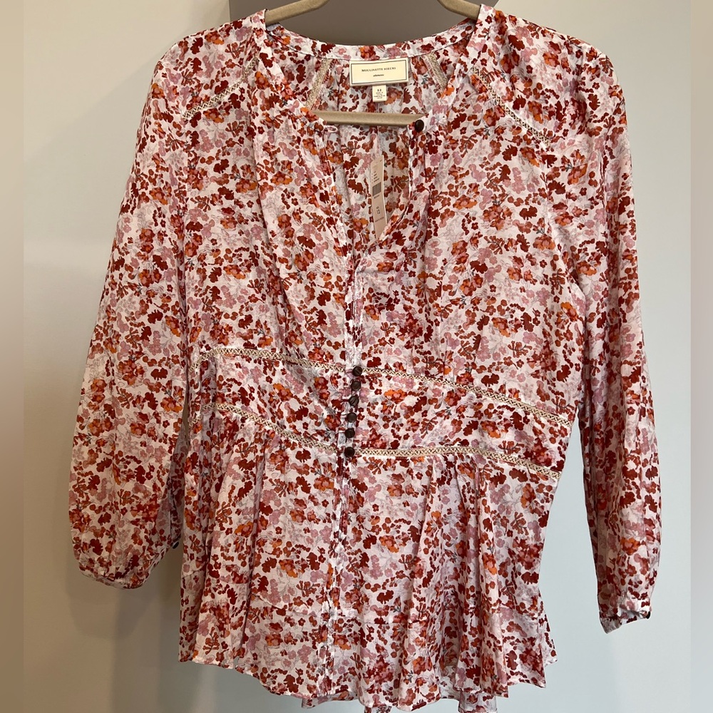 Moulinette Soeurs Anthropologie cotton and silk floral peplum style top.
